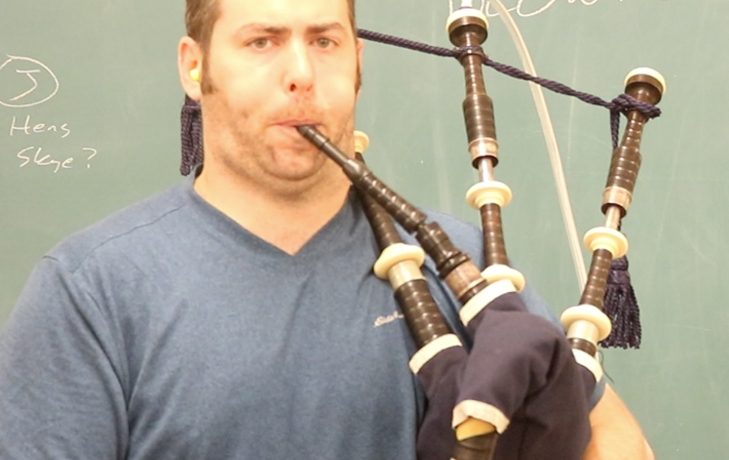 Andrew Douglas demonstrating the steady blowing trifecta while playing his bagpipes